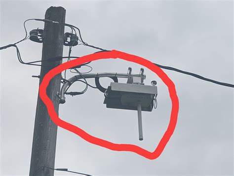 metal box next to utility pole|strange boxes on utility poles.